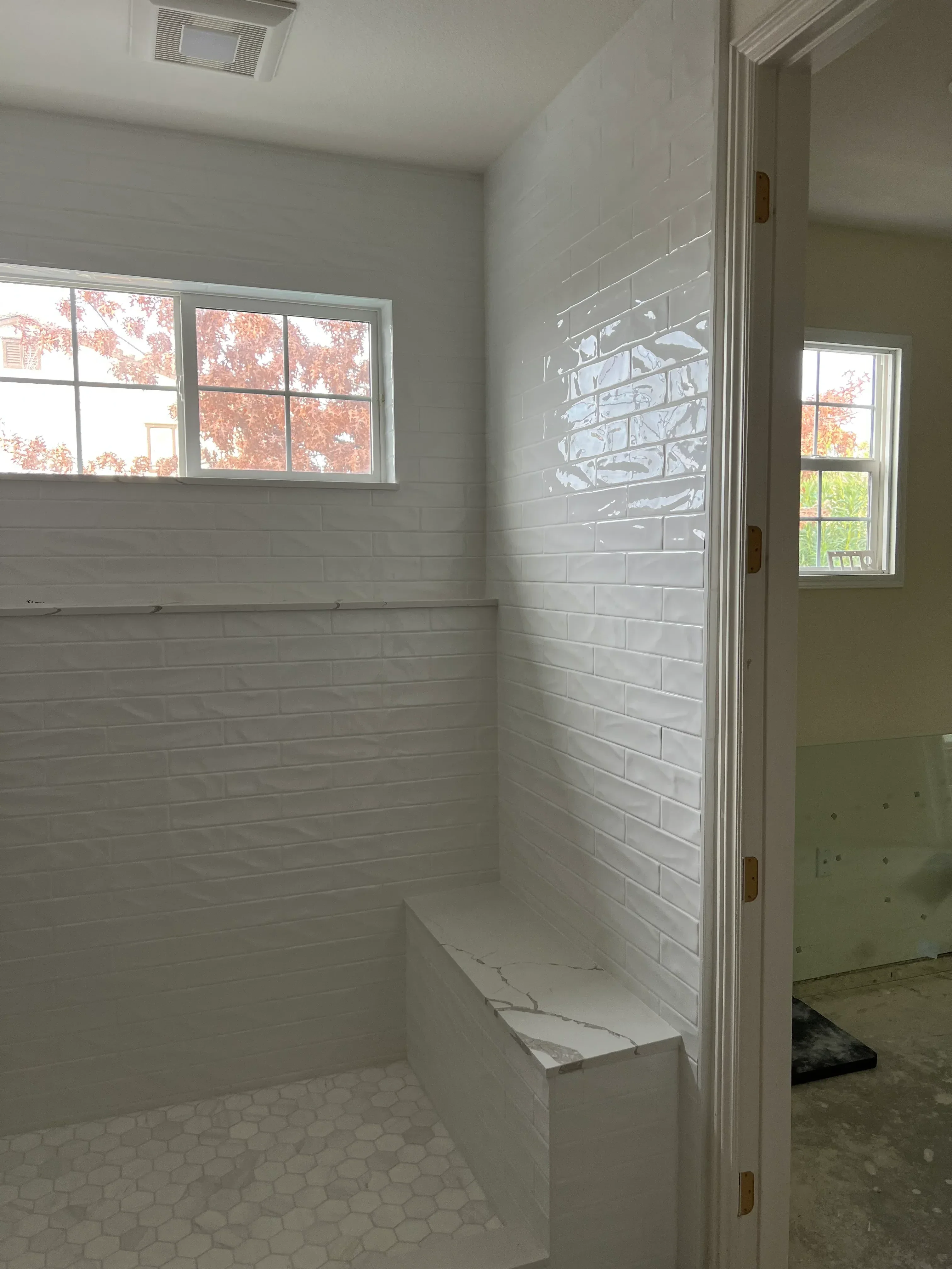 Shiplap drywall walls and vaulted ceiling with recessed lighting in kitchen renovation